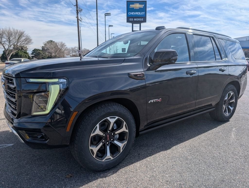 2026 GMC Yukon AT4 Ultimate in Titanium Rush Metallic — front three-quarter view
