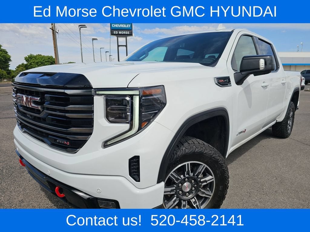 2025 GMC Sierra 1500 AT4 in Summit White — front three-quarter view